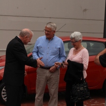 Mr and Mrs Coulson presented with the keys to their new car after winning the Wollongong City Council's Rates Incentive Scheme